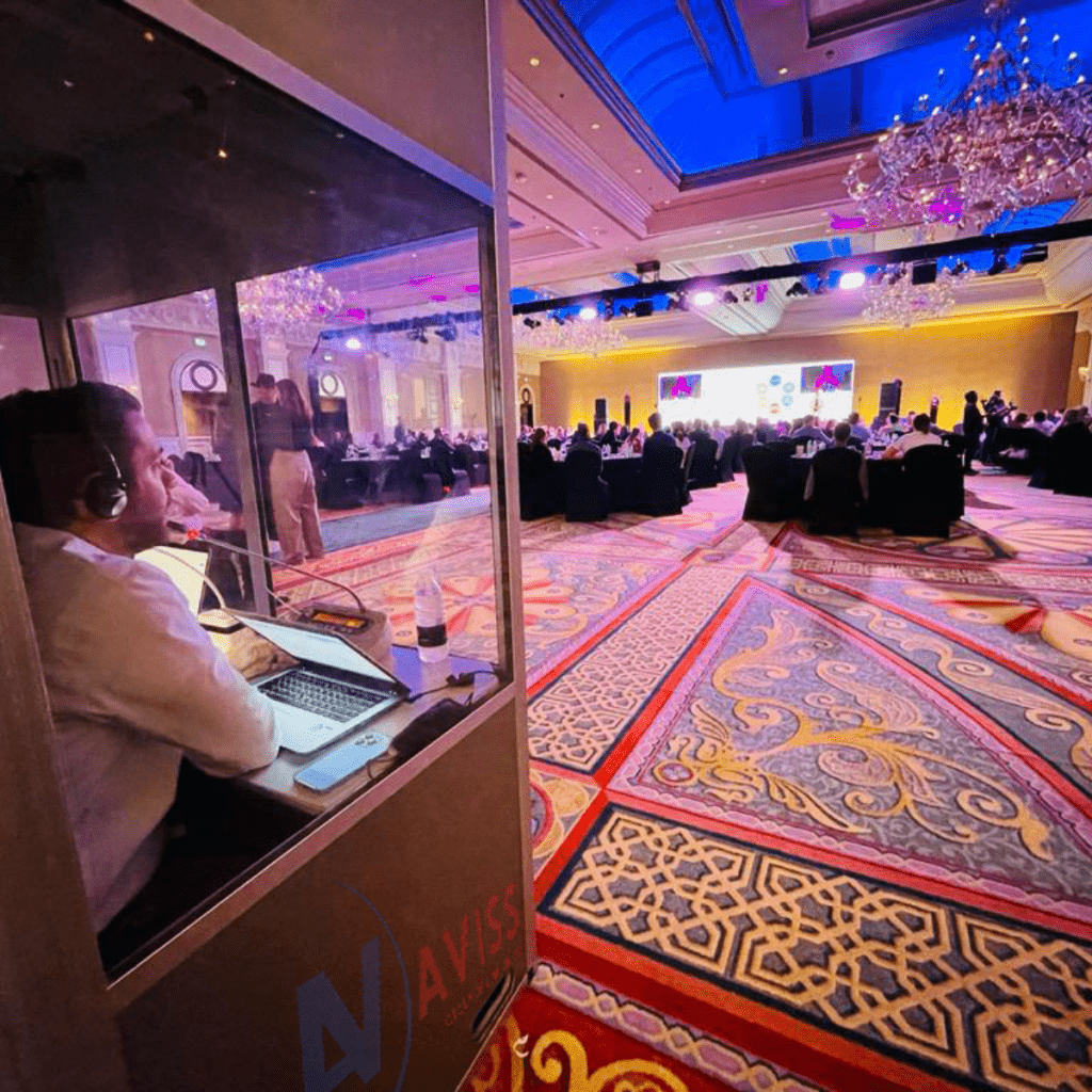 Breaking Language Barriers: How Simultaneous Interpretation Powers Global Events Simultaneous interpretation setup with booths and IR receivers in Dubai by Avissevent